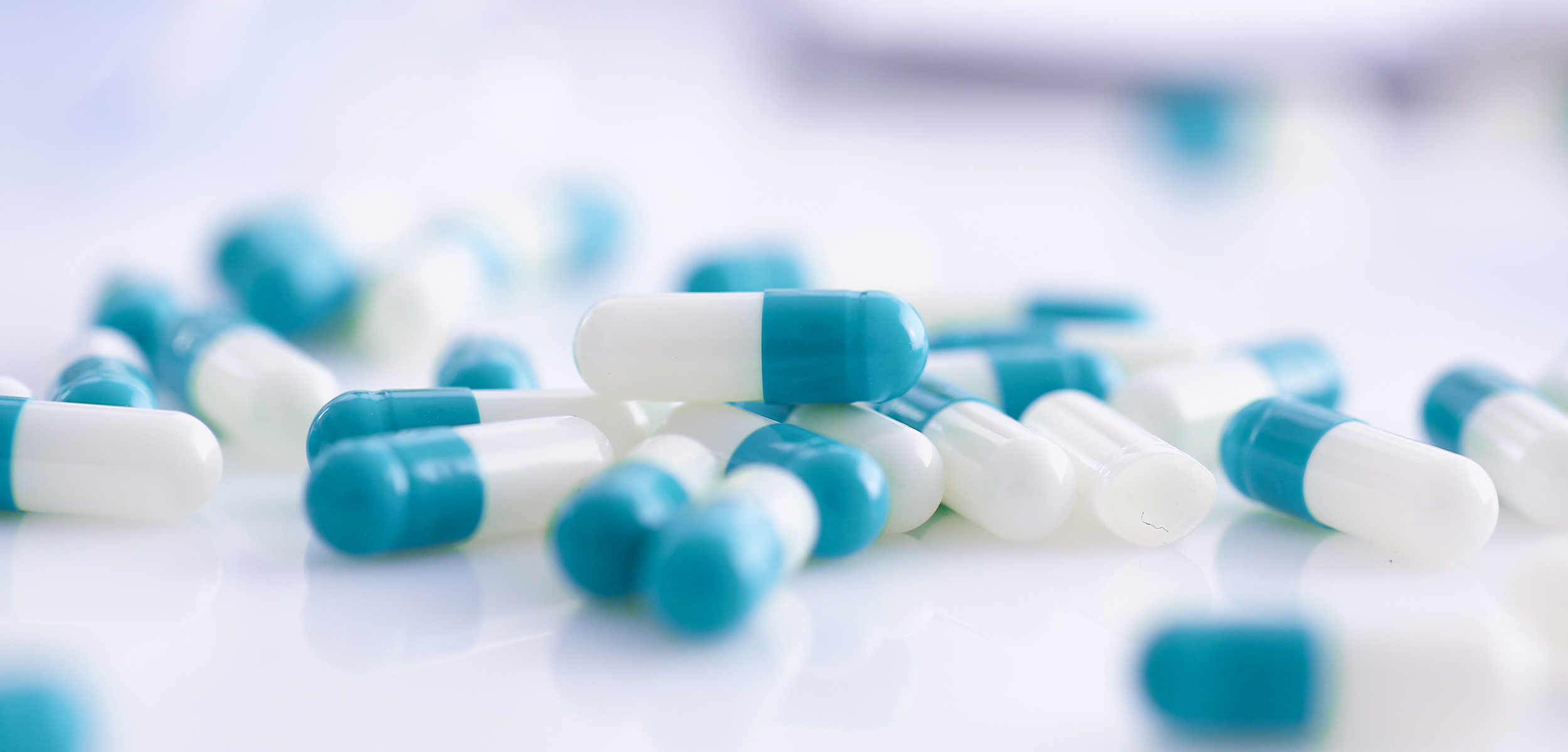 Tablets scattered on the table of the pharmaceutical laboratory pill for the prescription and treatment of various diseases chemistry